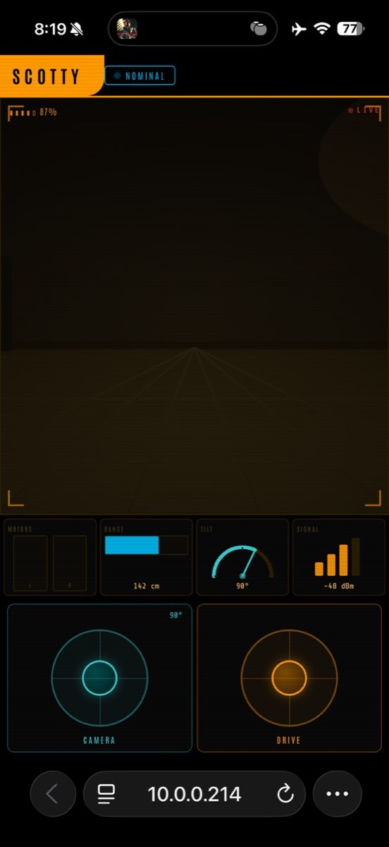 A phone screen in the same style: a dim camera view, an instrument strip, a teal camera joystick and an orange drive joystick.